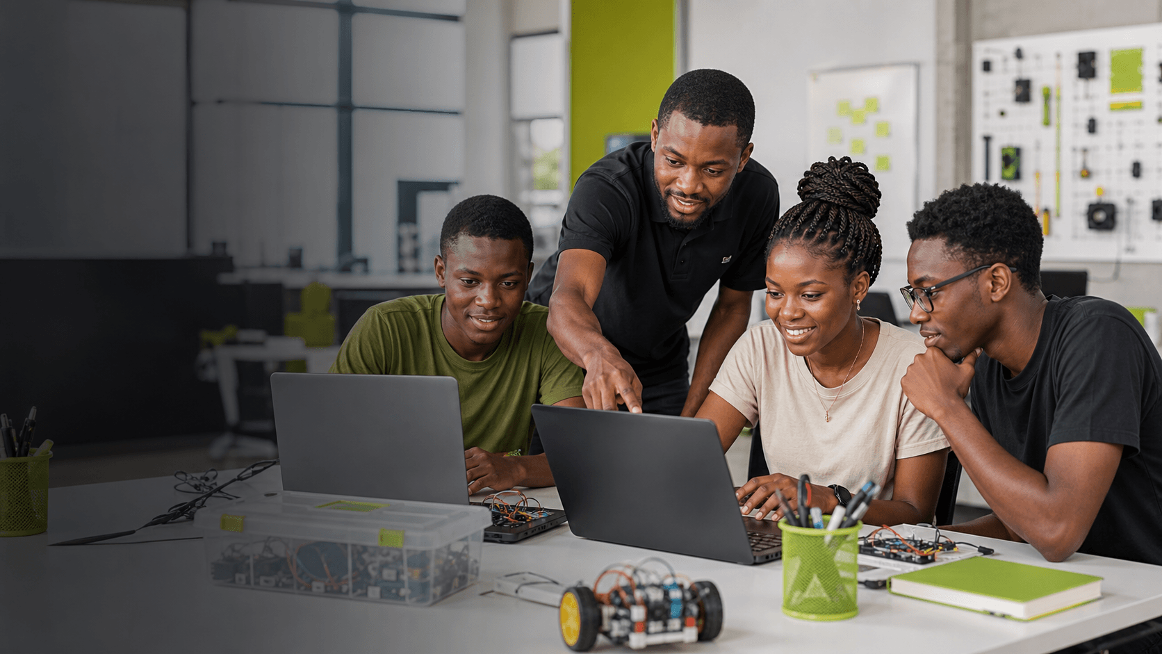 Students learning technical skills with computers facing them
